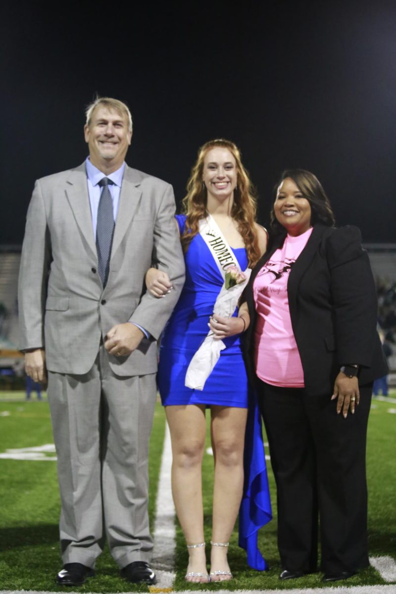 Homecoming Nominee: Sarah Wilson with  Principal Nicholson and her Dad